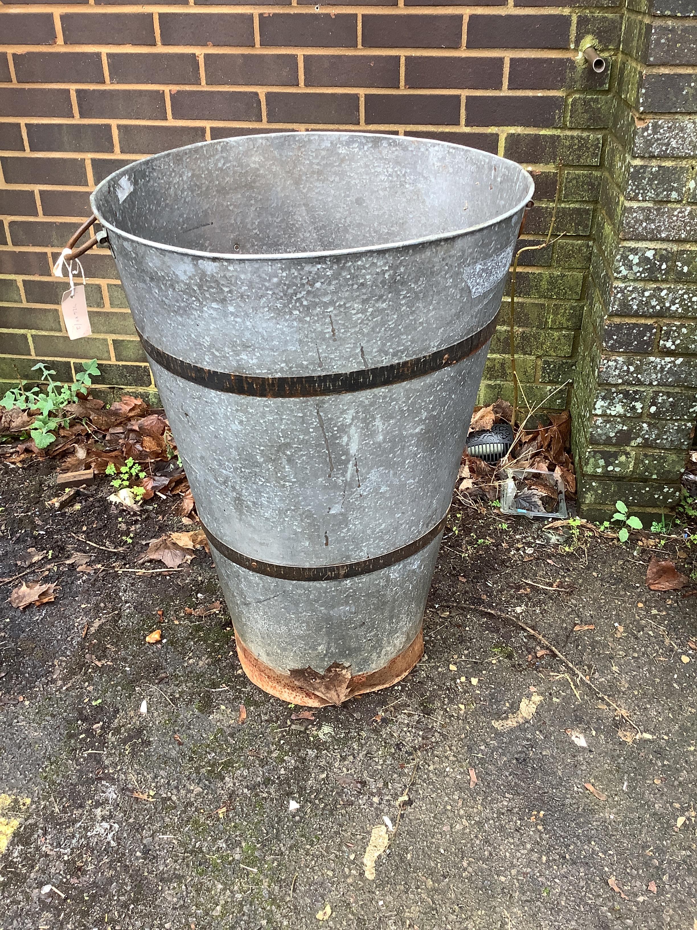 A circular tall galvanised container, diameter 55cm, height 86cm